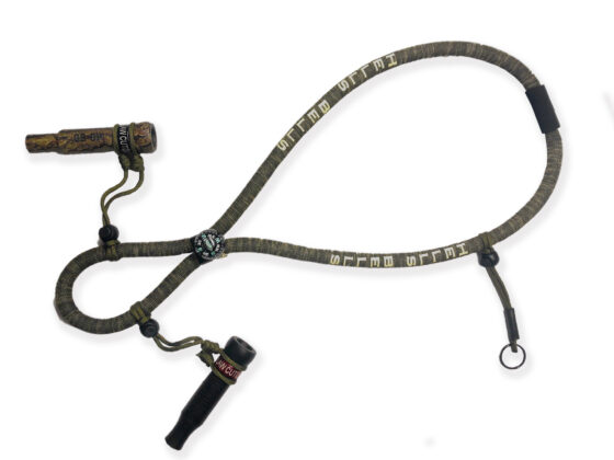 Hells Bells Camo Lanyard - The Double Drop Edition for Four Duck Calls with Screen Print and Compass Elevate your waterfowl hunting game with the Hells Bells Camo Lanyard - Double Drop Edition, capable of carrying four duck calls. This lanyard offers both form and function for dedicated hunters. Standout Features: Floating Duck Call Lanyard: Ensures your calls remain afloat if accidentally dropped in water. Built-in Compass: Navigate your hunting grounds confidently and return safely from each adventure. Please note: Duck calls are not included.