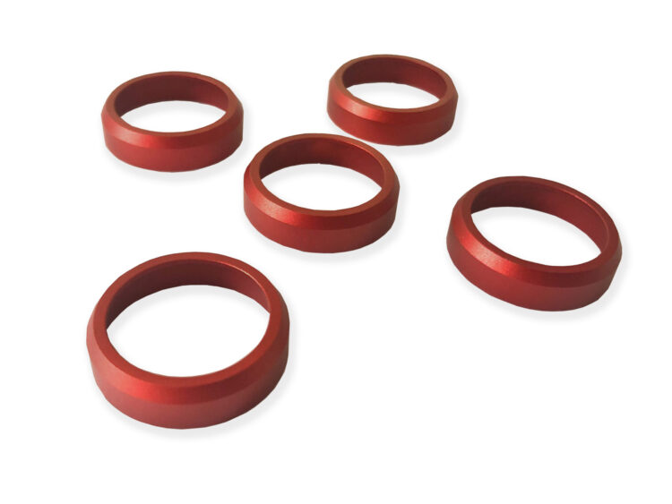 Red crack rings for duck call. These fit all Kirk McCullough duck calls. A perfect addition to your excellent duck calls and help them be effective all duck hunting season long. Aluminum Anodized, or Brass, tapered ring, fits most D-2, DJ Grafton, and other keyhole calls. The ring is applied with epoxy, preventing the barrel from cracking. These are aluminum Anodized, tapered rings, fits most D-2, DJ Grafton, and other keyhole calls. 1. Four shiny red aluminum rings on a white surface, perfect for preventing cracks in duck call barrels. Enhance your duck calls for a successful hunting season! 2. Enhance your duck calls with these four vibrant red aluminum rings. Prevent barrel cracks and ensure effective calls all season long. A must-have for cut-down duck calls! 3. Add a touch of style and functionality to your duck calls with these four red aluminum rings. Prevent barrel cracks and make your calls effective throughout the entire hunting season. Perfect for all Kirk McCullough duck calls!