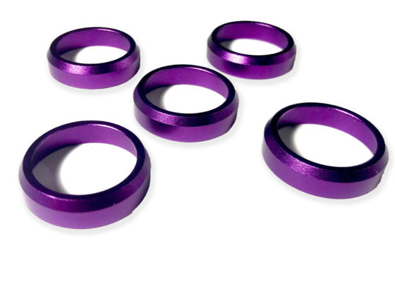 Purple crack rings for duck call. these fit all Kirk McCullough duck calls. A perfect addition to your excellent duck calls and help them be effective all duck hunting season long. Aluminum Anodized, or Brass, tapered ring, fits most D-2, DJ Grafton, and other keyhole calls. The ring is applied with epoxy, preventing the barrel from cracking. These are aluminum Anodized, tapered rings, fits most D-2, DJ Grafton, and other keyhole calls. 1. Four shiny purple aluminum rings on a white surface, perfect for preventing cracks in duck call barrels. Enhance your duck calls for a successful hunting season! 2. Enhance your duck calls with these four vibrant purple aluminum rings. Prevent barrel cracks and ensure effective calls all season long. A must-have for cut-down duck calls! 3. Add a touch of style and functionality to your duck calls with these four purple aluminum rings. Prevent barrel cracks and make your calls effective throughout the entire hunting season. Perfect for all Kirk McCullough duck calls!